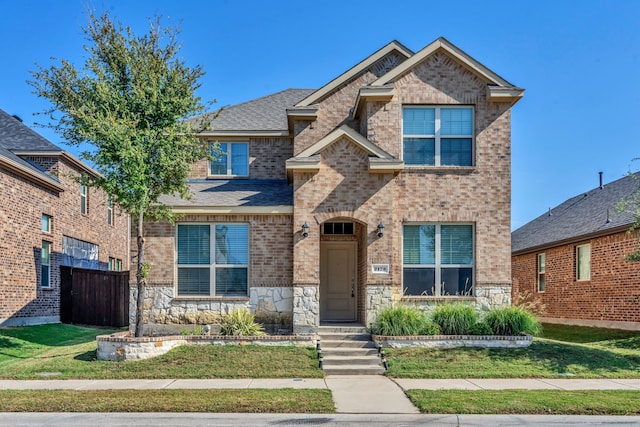 view of front of home with a front lawn