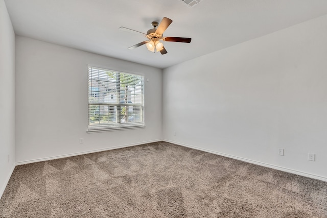 carpeted empty room with ceiling fan