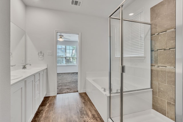 bathroom featuring vanity, ceiling fan, hardwood / wood-style flooring, and independent shower and bath