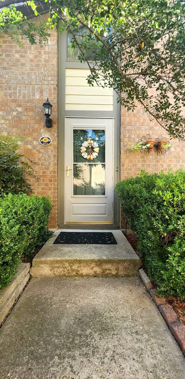 entrance to property with brick siding