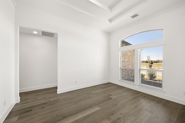 empty room with a tray ceiling and dark hardwood / wood-style flooring