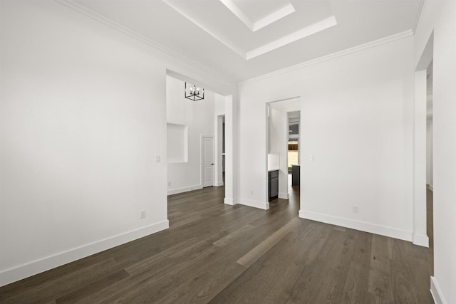 empty room with an inviting chandelier and dark hardwood / wood-style floors