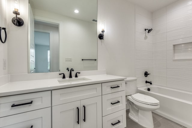 full bathroom featuring vanity, tiled shower / bath combo, and toilet