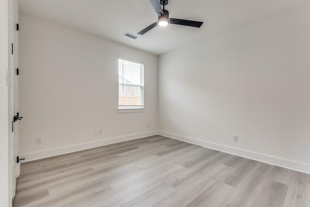 spare room featuring light hardwood / wood-style flooring and ceiling fan