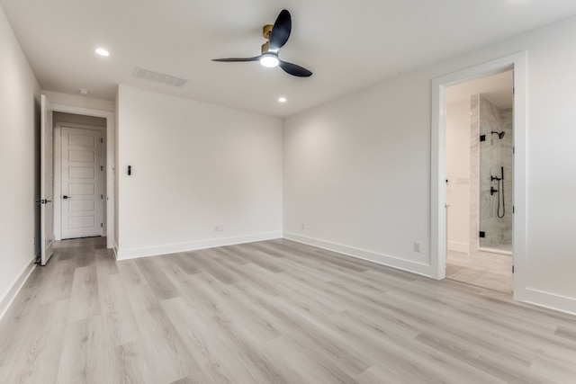 spare room featuring light hardwood / wood-style floors and ceiling fan