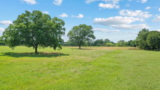 view of yard with a rural view