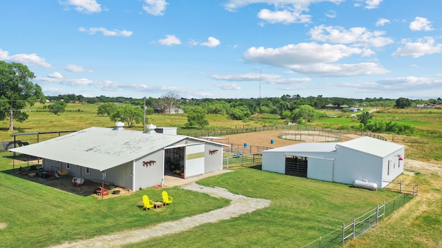 birds eye view of property featuring a rural view