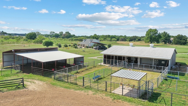 view of stable with a rural view