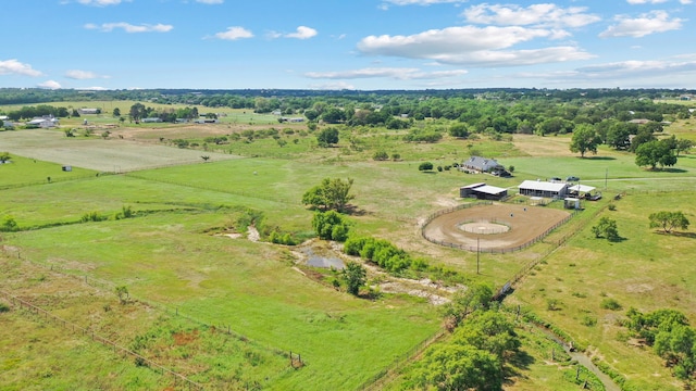 birds eye view of property with a rural view