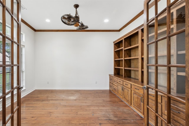 interior space featuring ornamental molding and hardwood / wood-style flooring