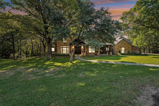 view of front of property with a lawn