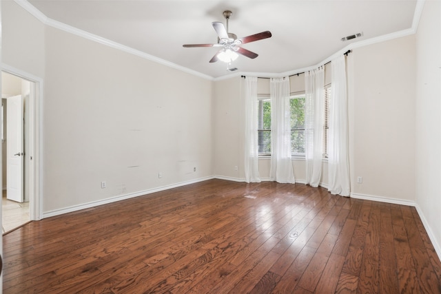 empty room with dark wood-type flooring, crown molding, and ceiling fan