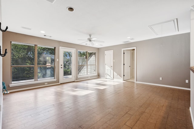 unfurnished room featuring light wood-type flooring and ceiling fan