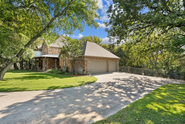 view of front of house featuring a front yard and a garage