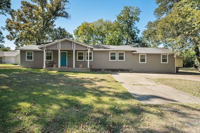 ranch-style home with a front lawn and covered porch