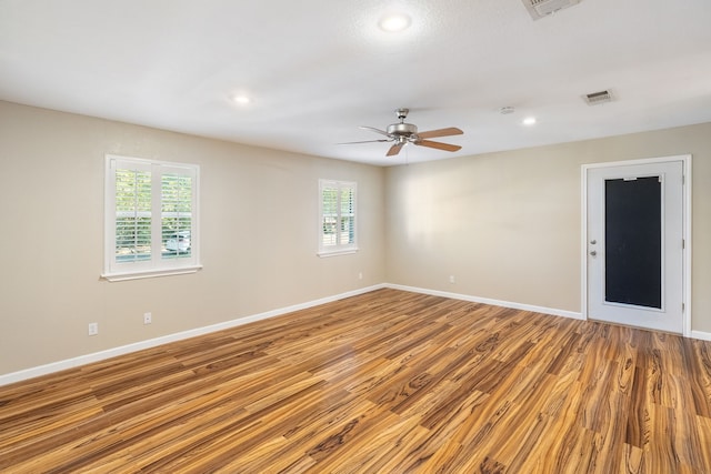 unfurnished room featuring ceiling fan and light hardwood / wood-style flooring