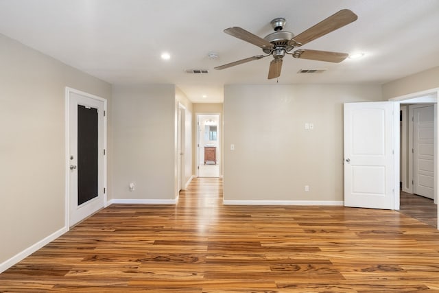 empty room with light wood-type flooring and ceiling fan