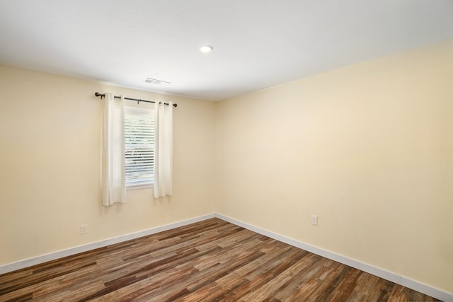 unfurnished room featuring wood-type flooring