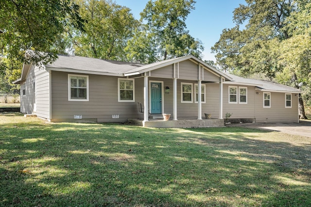 ranch-style house featuring a front lawn