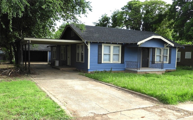 view of front facade with a front yard and a carport