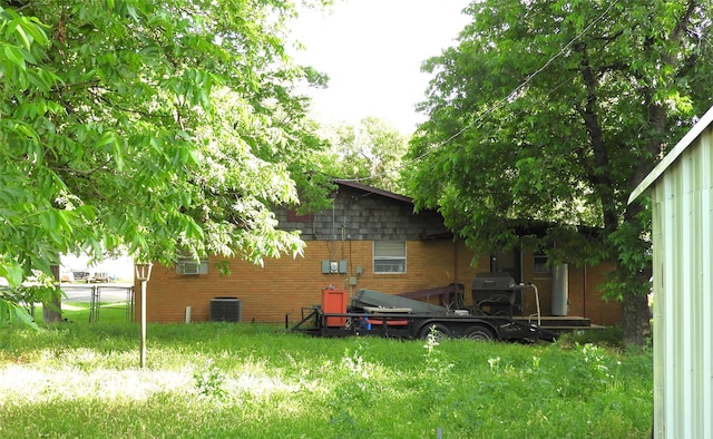 rear view of property with cooling unit