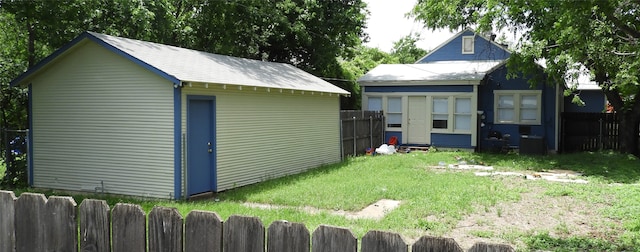 view of outbuilding featuring a yard