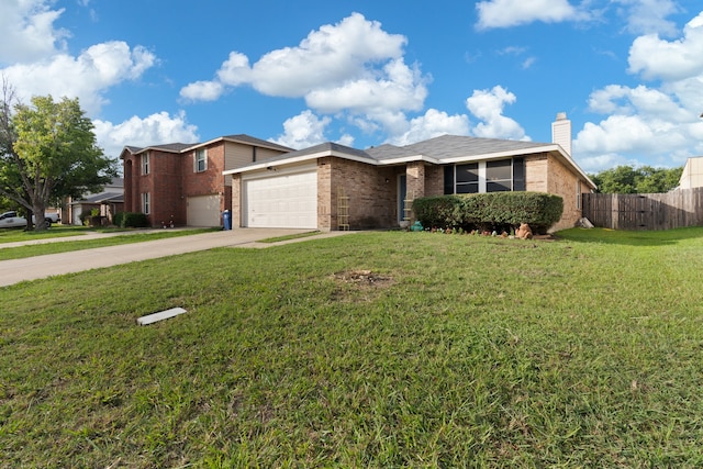 view of front of home with a garage and a front lawn