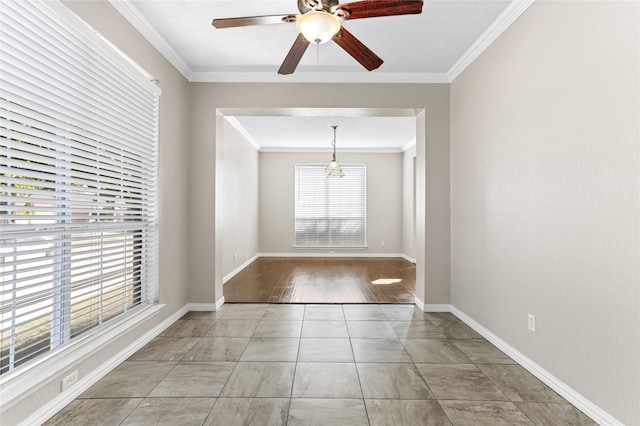 interior space with a healthy amount of sunlight, ornamental molding, and light hardwood / wood-style flooring