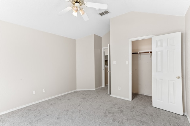 unfurnished bedroom with vaulted ceiling, light carpet, and ceiling fan