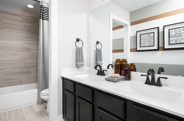 4127 Olmsted Dr, Rockwall, TX 75032 - full bathroom featuring vanity, shower / bath combination with curtain, and toilet