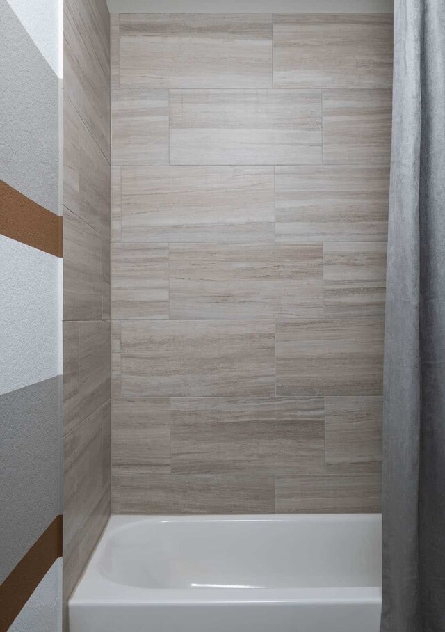 4127 Olmsted Dr, Rockwall, TX 75032 - bathroom featuring shower / bath combination with curtain