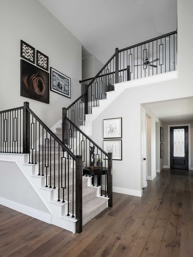 4127 Olmsted Dr, Rockwall, TX 75032 - stairs with a high ceiling and hardwood / wood-style flooring