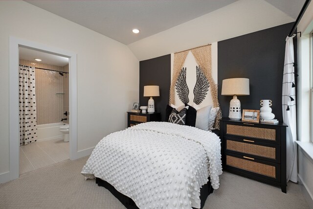 4127 Olmsted Dr, Rockwall, TX 75032 - bedroom featuring vaulted ceiling, light carpet, and ensuite bath