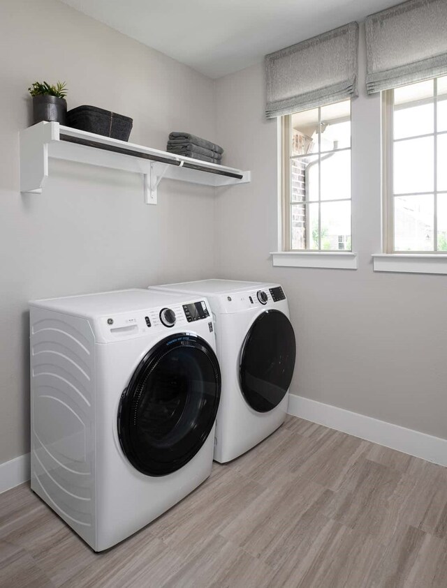 4127 Olmsted Dr, Rockwall, TX 75032 - laundry room with light hardwood / wood-style floors and independent washer and dryer