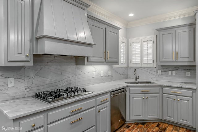 kitchen with decorative backsplash, custom range hood, stainless steel appliances, and sink