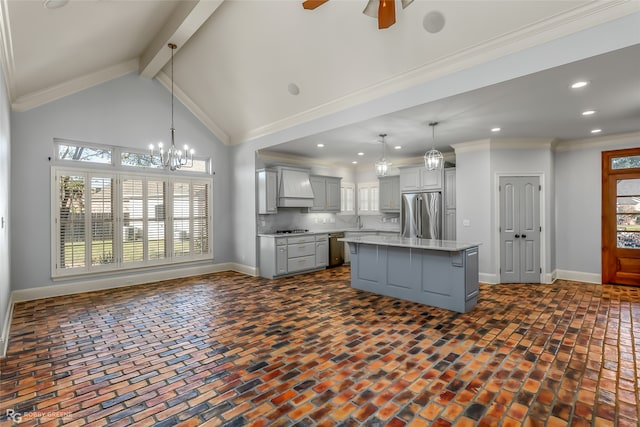 kitchen with a kitchen island, custom exhaust hood, pendant lighting, gray cabinets, and crown molding