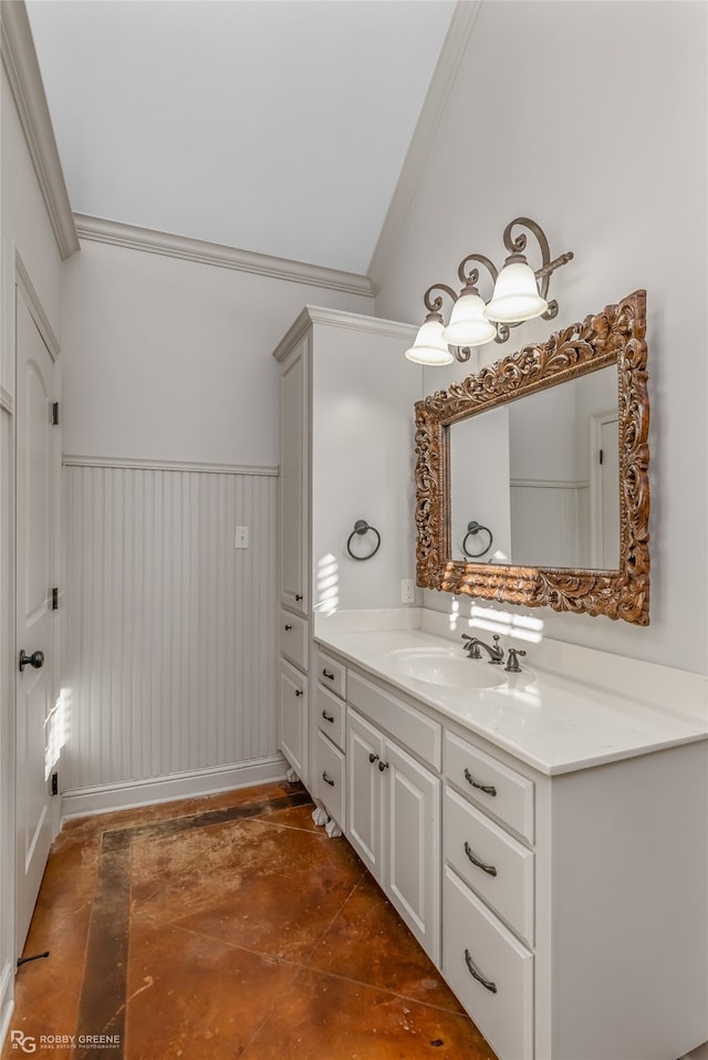 bathroom with vanity, crown molding, and wooden walls