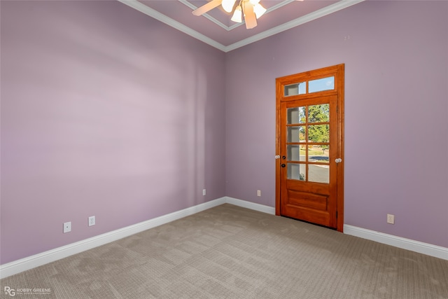 empty room featuring light carpet, ornamental molding, and ceiling fan