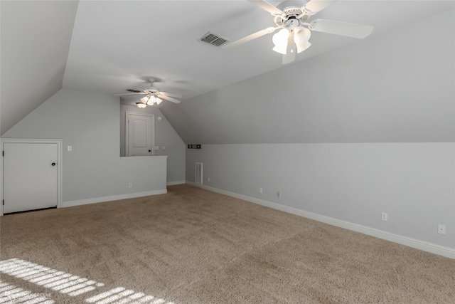 additional living space featuring lofted ceiling, carpet, and ceiling fan