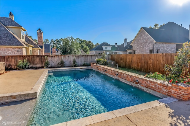 view of pool with pool water feature