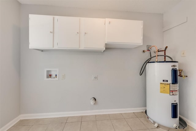 washroom featuring cabinets, washer hookup, light tile patterned floors, water heater, and hookup for an electric dryer