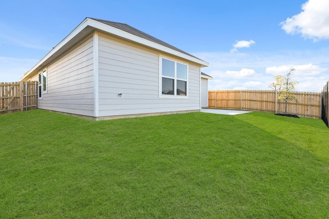 rear view of house with a yard