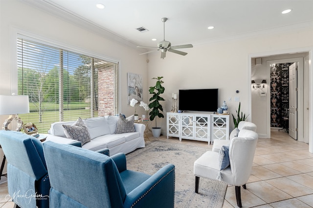 living room featuring ceiling fan, crown molding, and light tile patterned floors