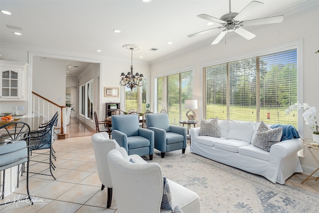 living room featuring crown molding, light hardwood / wood-style flooring, and ceiling fan with notable chandelier