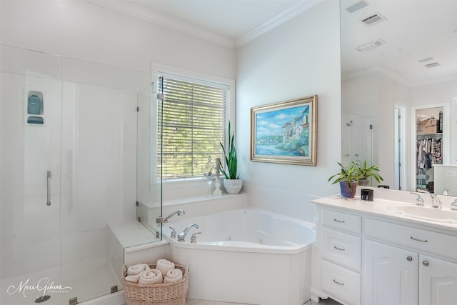 bathroom with vanity, ornamental molding, and separate shower and tub