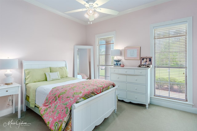 bedroom with light carpet, crown molding, and ceiling fan