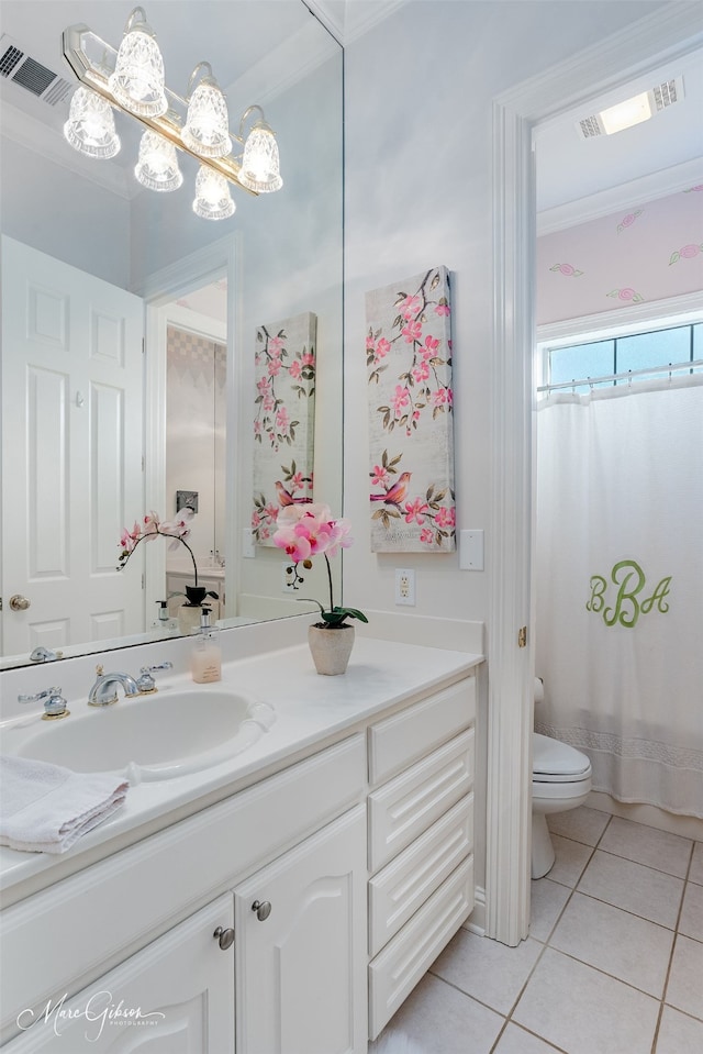 bathroom featuring toilet, tile patterned floors, walk in shower, vanity, and crown molding