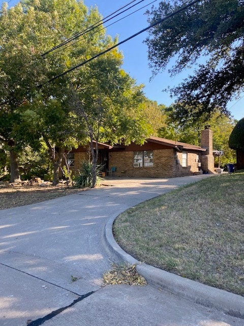 view of property exterior with a lawn