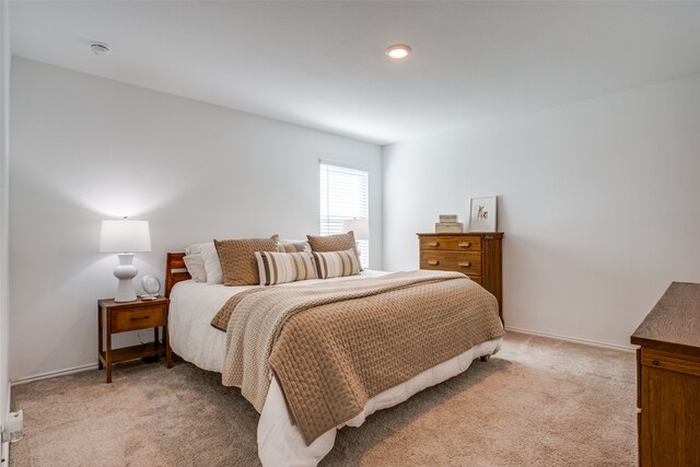 bedroom with light carpet