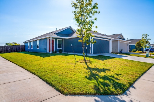 single story home featuring a garage and a front lawn